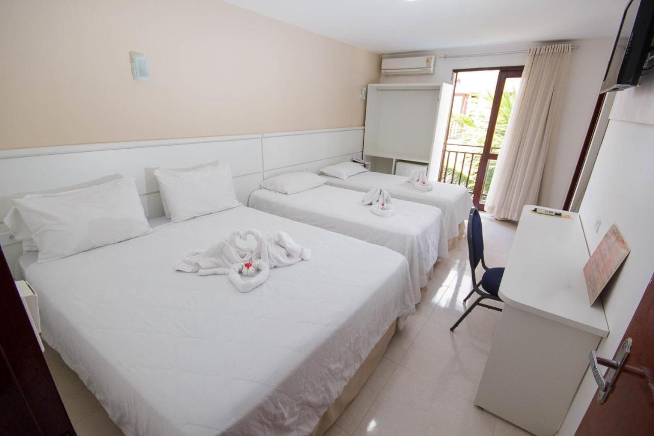 Quarto Quádruplo com Vista Mar Parcial.
